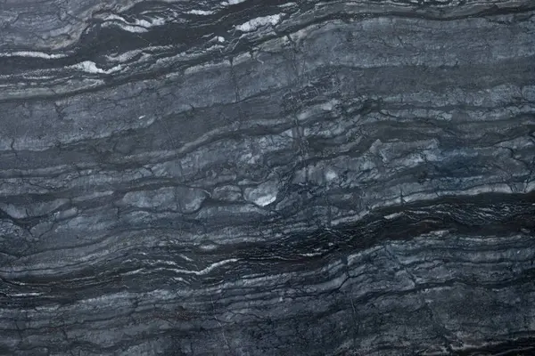 Arkaplan olarak koyu mermer yüzeyin dokusu, üst görünüm