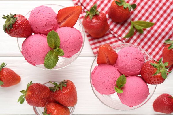 Refreshing sorbet, strawberries and mint on white wooden table, flat lay