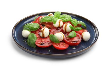 Mozarella, domates, fesleğen ve balzamik sirkeli Caprese salatası.