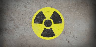 Gri taş zemin üzerinde sarı radyoaktif tabela, pankart tasarımı. Radyolojik kirlilik