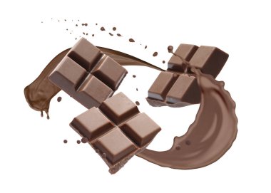 Çikolata ve kakao parçaları beyaz arka planda su sıçratır.