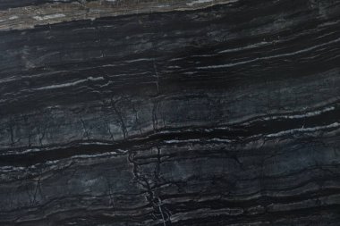 Arkaplan olarak koyu mermer yüzeyin dokusu, üst görünüm