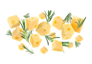 Peynir küpleri ve biberiye beyaz arka planda uçuyor