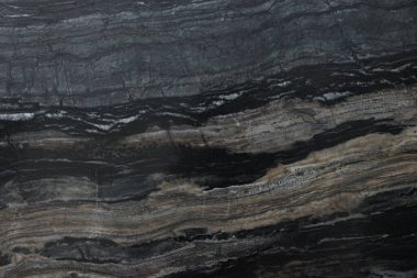 Arkaplan olarak koyu mermer yüzeyin dokusu, üst görünüm