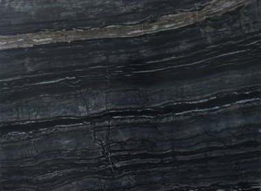 Arkaplan olarak koyu mermer yüzeyin dokusu, üst görünüm