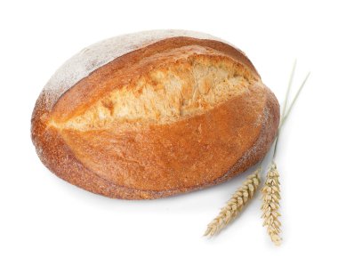 Bir somun taze ekmek ve dikenler beyazın üzerinde izole edilmiş.