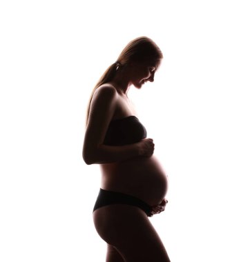 Beyaz arka planda hamile kadın silueti