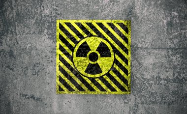 Gri desenli yüzeyde radyoaktif işaret var. Radyolojik kirlilik