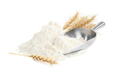 Beyaz arka planda buğday unu, kepçe ve dikenler