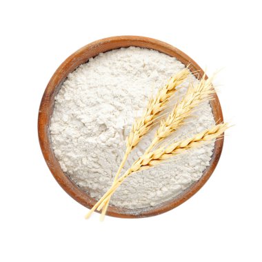 Kasede buğday unu ve beyaz arka planda dikenler, üst manzara.