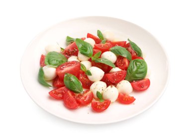 Peynirli, domatesli, fesleğenli ve baharatlı Caprese salatası.