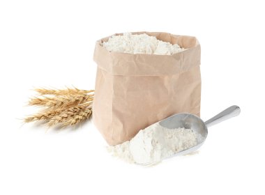 Beyaz arka planda buğday unu ve dikenler