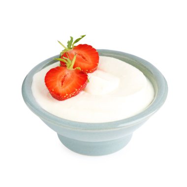 Lezzetli yoğurt kasede ve beyaz çilekli.