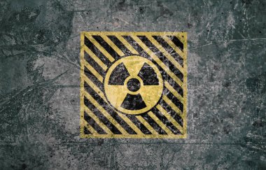 Gri desenli yüzeyde radyoaktif işaret var. Radyolojik kirlilik