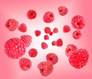 Pembe eğimli arka planda havada dönen taze ahududu.