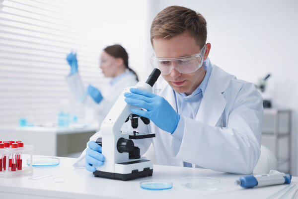 Medical analysis. Scientists working with samples in laboratory, selective focus