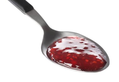 Beyaz kaşık içinde tatlı ahududu reçeli