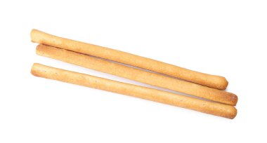 Lezzetli Grissini çubukları beyaza izole edilmiş, üst manzara