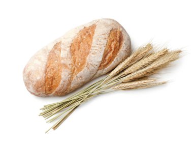 Bir somun taze ekmek ve dikenler beyaz, üst manzara izole