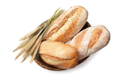 Taze ekmek somunları ve beyaz arka planda dikenler.