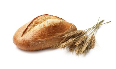 Bir somun taze ekmek ve dikenler beyazın üzerinde izole edilmiş.