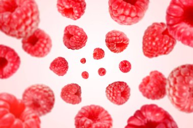 Beyaz arka planda havada dönen taze ahududular.