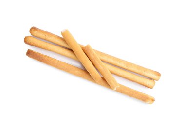 Lezzetli Grissini çubukları beyaza izole edilmiş, üst manzara