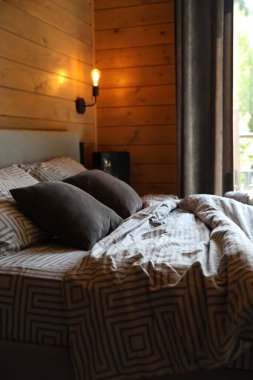 Big comfortable bed in stylish hotel room