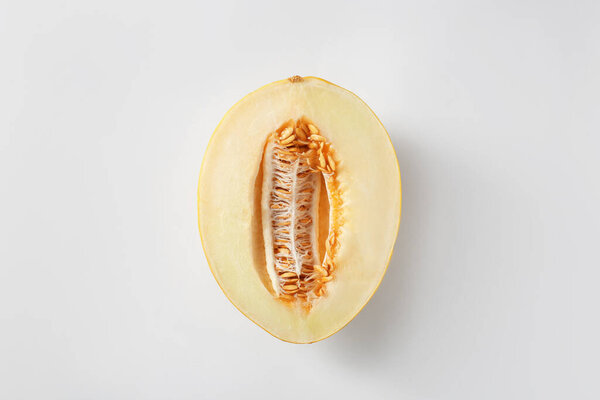 Half of ripe melon on white background, top view