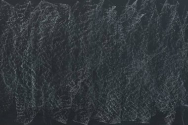 Arkaplan olarak kirli kara kara tahta. Okul ekipmanı