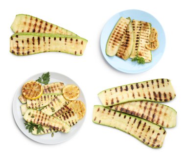 Beyaz arka planda limon ve maydanozlu ızgara kabak dilimleri. Üst görünüm