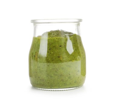 Fresh pesto sauce in jar isolated on white