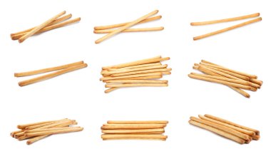 Delicious grissini sticks isolated on white, set