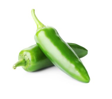 Two green jalapeno peppers isolated on white
