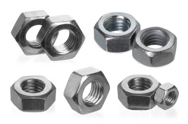 Beyaza izole edilmiş farklı altıgen metal fındıklar.