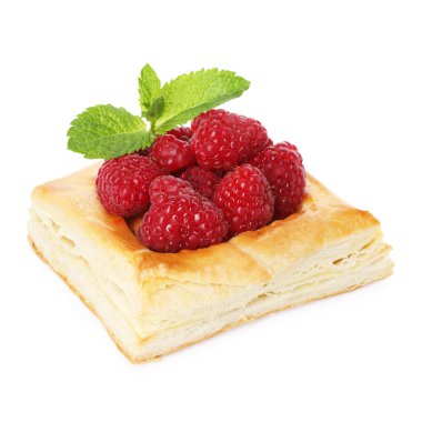 Yummy puff pastry with raspberries and mint isolated on white