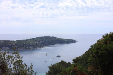 Picturesque view of city, sea and boats under beautiful sky with clouds