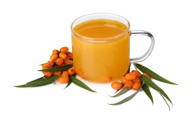 Cup of sea buckthorn tea and fresh berries isolated on white