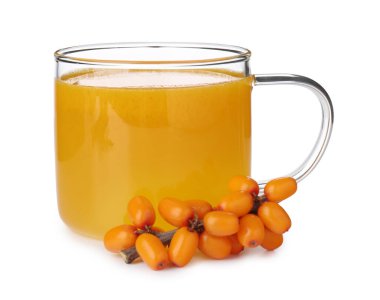 Cup of sea buckthorn tea and fresh berries isolated on white