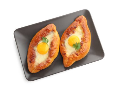 Tasty khachapuris with cheese, eggs and parsley isolated on white, top view