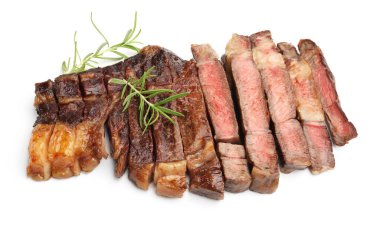Pieces of delicious grilled beef steak with rosemary isolated on white