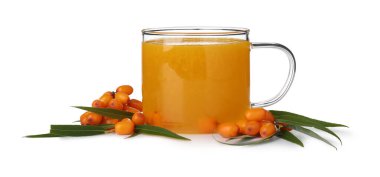 Cup of sea buckthorn tea and fresh berries isolated on white