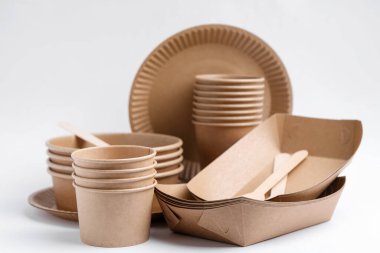 Set of disposable tableware on white background, closeup