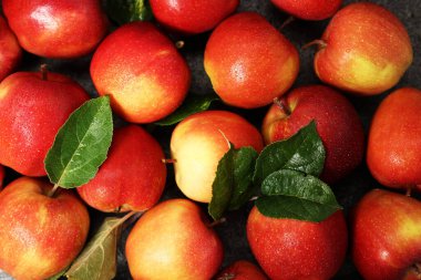 Fresh ripe apples on grey table, closeup