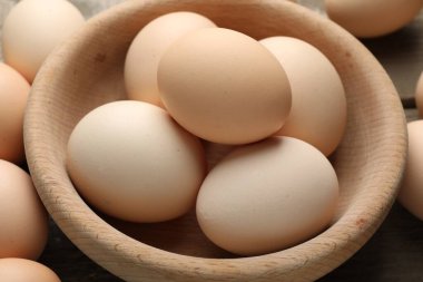 Fresh raw chicken eggs on table, closeup