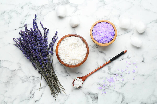 Sea salt and lavender on white marble table, flat lay