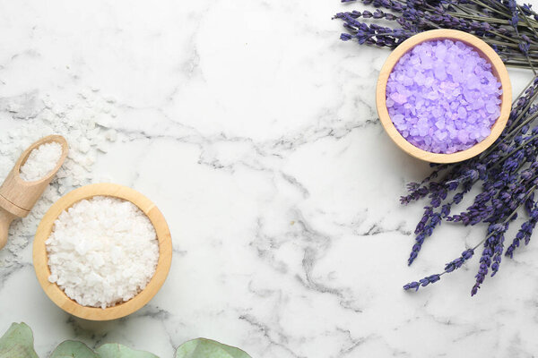 Sea salt and lavender on white marble table, flat lay. Space for text