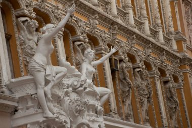 Odessa, Ukraine. July 18, 2018. City passage. Beautiful ancient architecture and sculptures on the facade. European style building exterior