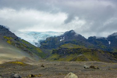 Svartifoss waterfall in Skaftafell Vatnajokull National Park, Iceland with green dramatic landscape