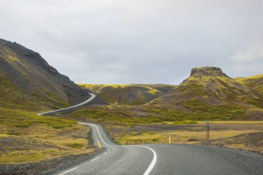 Beautiful Reflection of Houses, Church, Highway and Rainbow Road in Seydisfjordur Town in Iceland